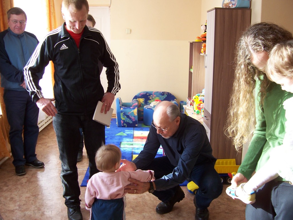 Oleg and Alan greet orphan