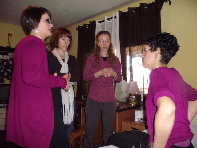 Sadia, (right) a woman who is paralyzed explains to Denya and Niki how she was shot in the back during the war and is now in a Wheelchair. She is suffering from pressure sores and is doing the best she can in treating them.
